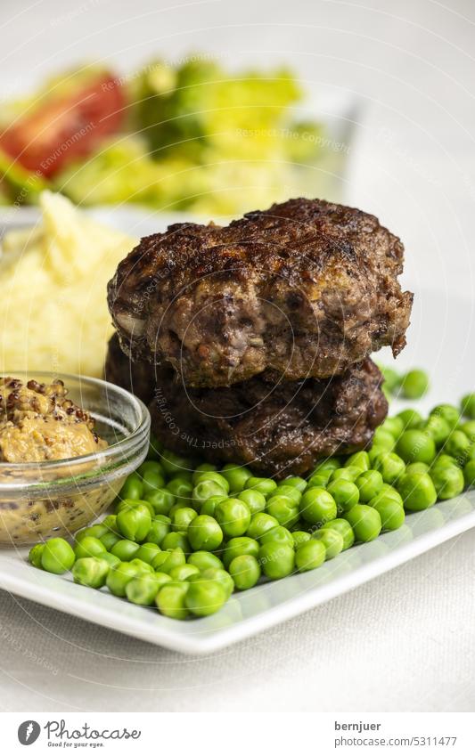 Bavarian meatballs with peas chopped roast Pea bulette Minced meat Roasted Meat Wood background tribunal traditionally sliced Meal Eating Dinner luscious