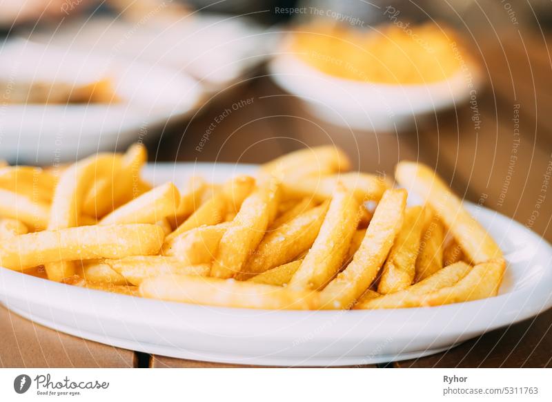 french fries on plate. street food, snacks travel fast food cook French Fries close up fried american unhealthy meal cafe fastfood gourmet cuisine chips