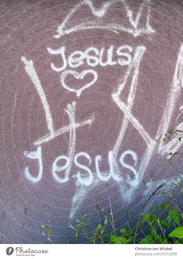The word "Jesus" and a heart were painted on a plastered facade Heart Graffiti Christianity Church Hope Belief Religion and faith Jesus Christ religion