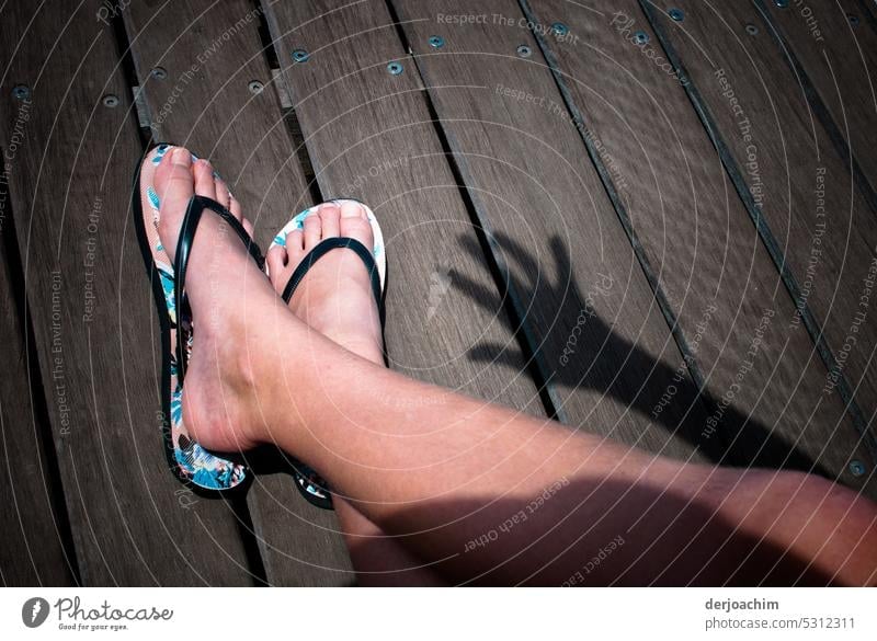 Two bare feet in sandals in the sunshine with a hand shadow. naked feet Feet Summer Legs Barefoot Skin Exterior shot Relaxation Toes Feminine Colour photo