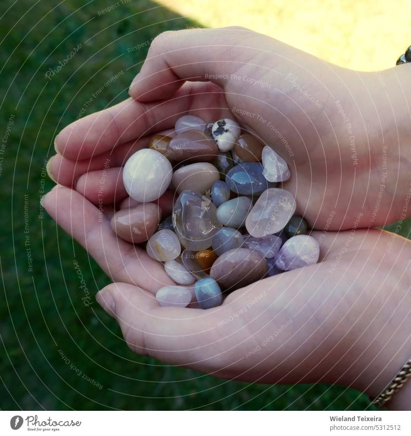 Tumble finished mixture of semi-precious stones in the hands of a girl Brown colourful Colour Nature pretty naturally Outdoors Close-up Crystal Geology mineral