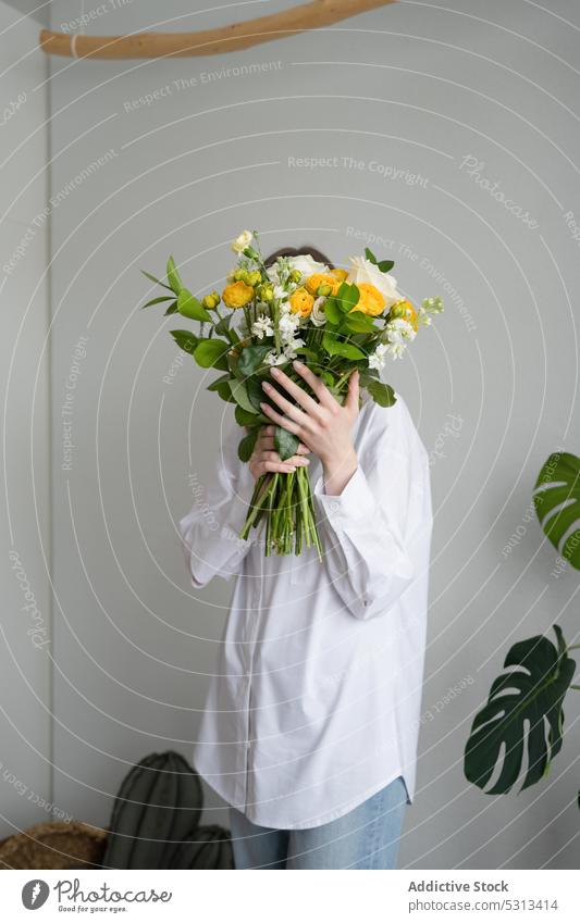 Anonymous woman with bouquet of flowers plant flora fresh floral bloom blossom bunch female delicate aroma botany design present room florist growth gift petal