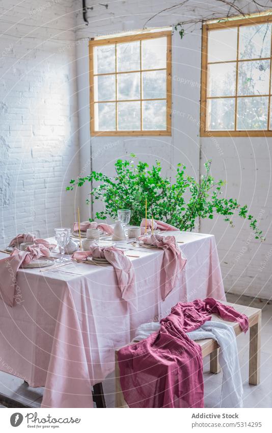 Dining table with napkin and bench tablecloth brick wall potted dishware plant flower creative fabric style pink window cute decor interior wooden tableware