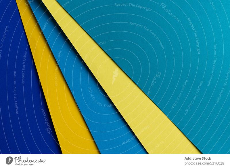 Arranged sheets of colorful carton layout blue yellow background tone blocking shade cardboard surface material design texture trend simple minimalist paper