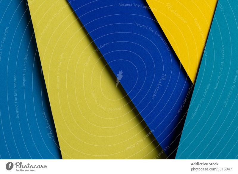 Arranged sheets of colorful carton layout blue yellow background tone blocking shade cardboard surface material design texture trend simple minimalist paper