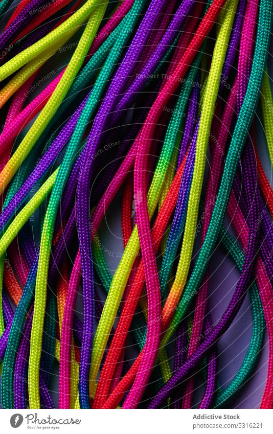 Vibrant colorful laces in pile rope twine vibrant multicolored vivid bright layout string mix shoelace cord fabric spectrum fiber untied art material minimalist