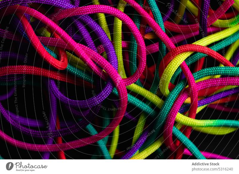 Vibrant colorful laces in pile rope twine vibrant multicolored vivid bright layout string mix shoelace cord fabric spectrum fiber untied art material minimalist