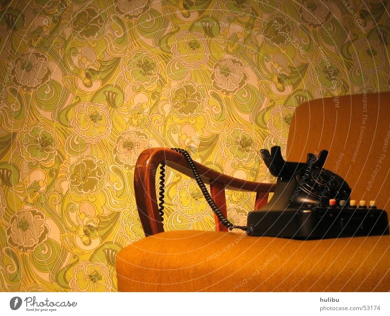 Still no one around? Seventies Sixties Vintage car Retro Armchair Telephone Wall (building) Wallpaper Carpet Brown Green Pattern Floral wallpaper