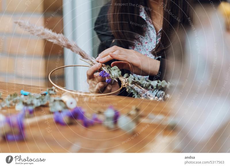 Woman tying wreath or bouquet with dried flowers Dried flowers Ostrich Wreath Bouquet of dried flowers Detail hands Hand Craft (trade) Nature Flower Bond