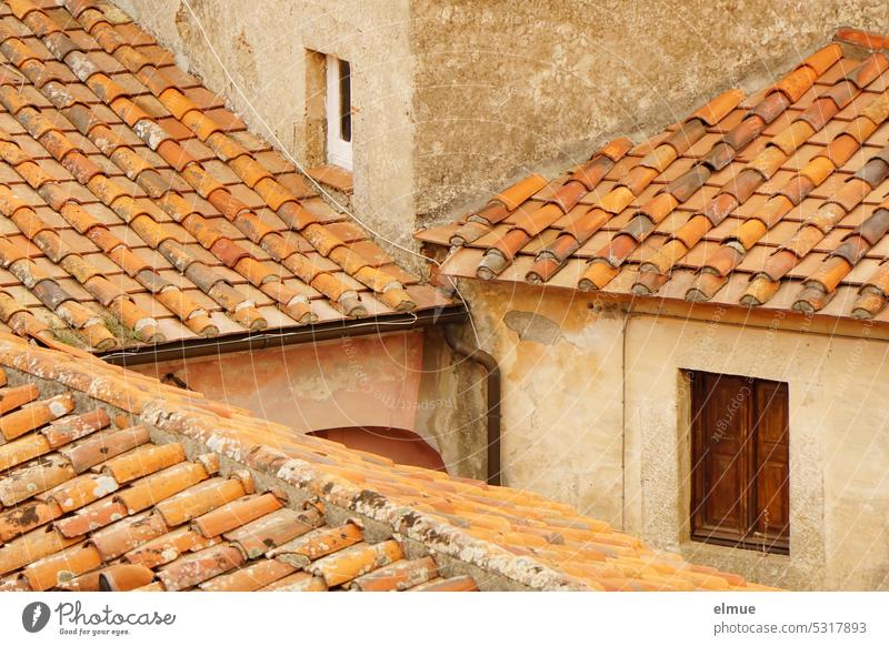 living on Elba - residential buildings built together with tiled roofs Apartment Building Marciana Alta Tiled roof Roofing tile Italy Island Blog