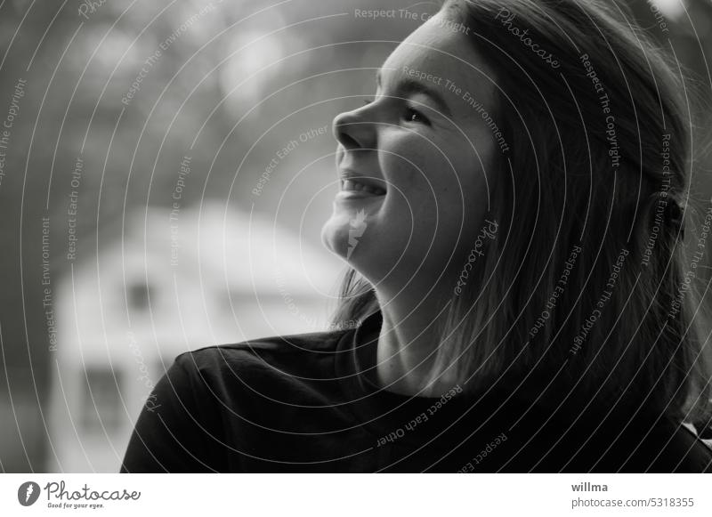 Young pretty woman looks to the side with a sympathetic happy laugh portrait Woman young girl cheerful Laughter fortunate Attractive Congenial endearing Happy