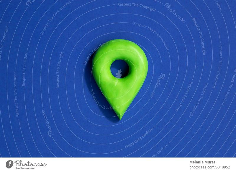 Green location symbol of pin on blue background, 3d GPS pin icon, location concept. abstract address button cartography color design destination direction