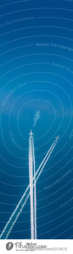 Two Planes Cross Each Other's Trajectories. Concept Of Travel. Flying Airplane On Sky Background Soft Colors. Dream And Travel. Advertise Of Airlines. Air Travels Copy Space. Vertical Photo