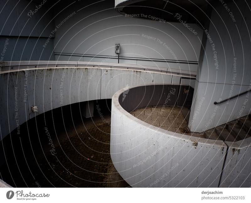 A curved walkway in concrete. Concrete construction Colour photo Exterior shot Day Gray Concrete wall Town Manmade structures Wall (barrier) Architecture