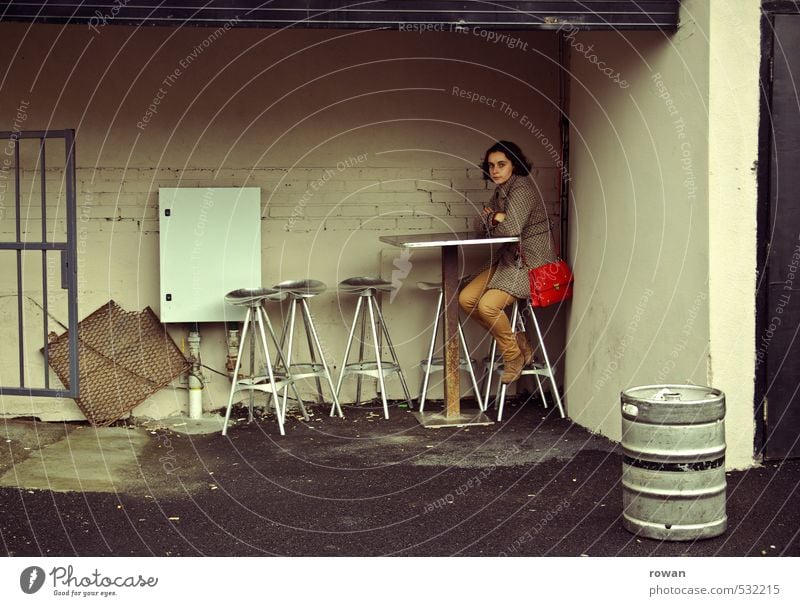 waiting Human being Feminine Young woman Youth (Young adults) Woman Adults 1 Town Patient Calm Loneliness Sit Stool Bar Beer table Beer keg Individual Shabby