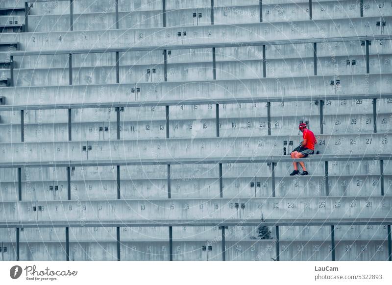 Break in the stadium empty ranks Man person Gray Concrete Red red person stagger rail Banister free seating series Structures and shapes Stairs lines Empty