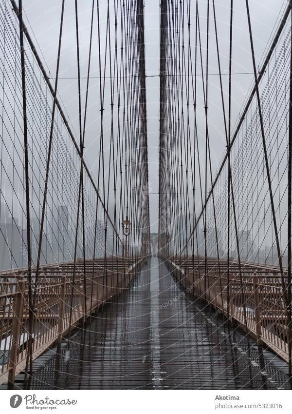 Empty brooklyn bridge walk in heavy rain Brooklyn Bridge New York City Rain landmark picture travel USA NYC urban Deserted Cloud forest Steel cable Wire cable