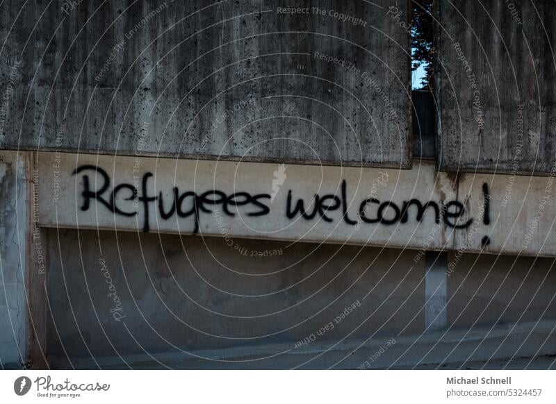 Lettering on concrete wall "Refugees welcome!" refugees welcome Politics and state Graffiti Solidarity Fairness Humanity Society Responsibility Respect Sign
