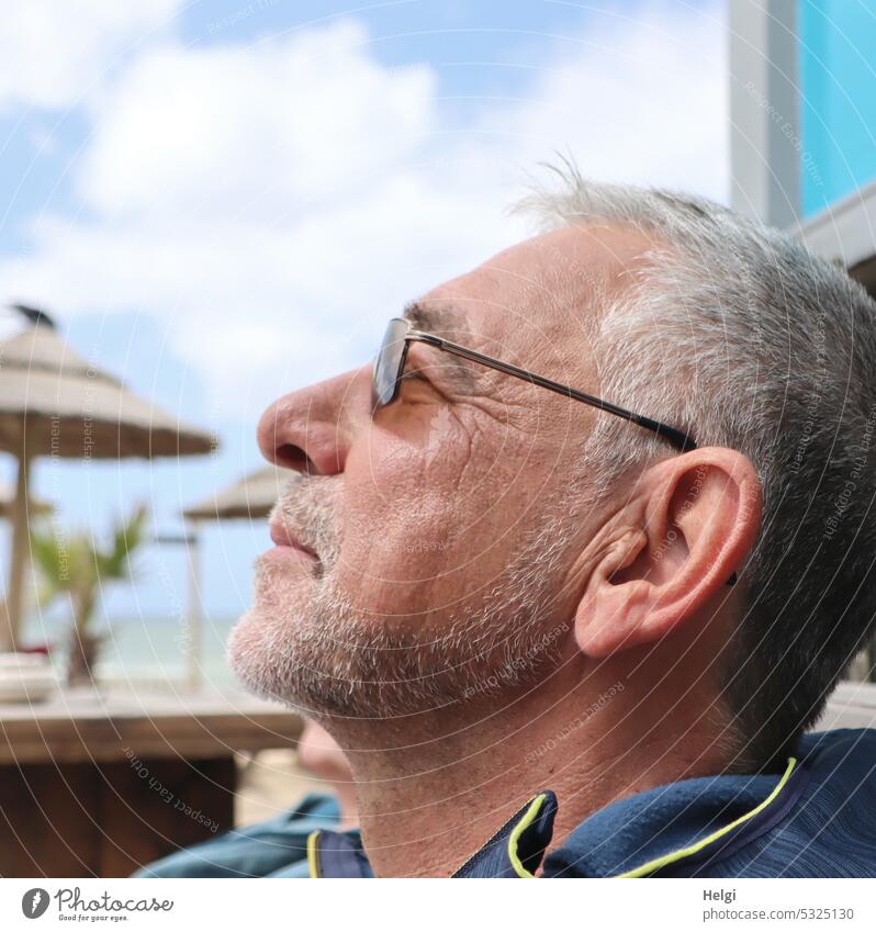 Enjoying the sun - portrait of a gray-haired senior with three-day beard and sunglasses in profile Human being Man Senior citizen Profile Head Face Short-haired