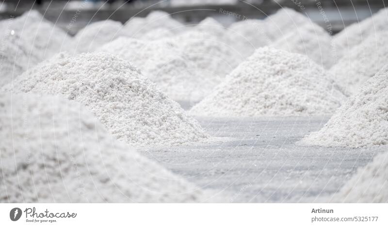 Sea salt farm. Pile of brine salt. Raw material of salt industrial. Sodium Chloride mineral. Evaporation and crystallization of sea water. White salt harvesting. Agriculture industry. Traditional farm