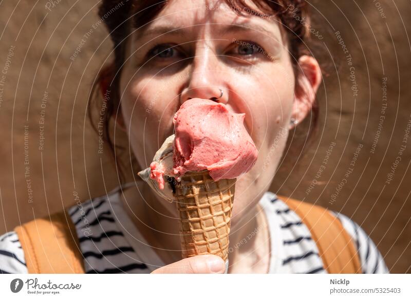 young attractive woman licking ice cream and looking at camera Ice Woman youthful Young woman pretty Summer Italian Tuscany Ice cream Strawberry ice cream