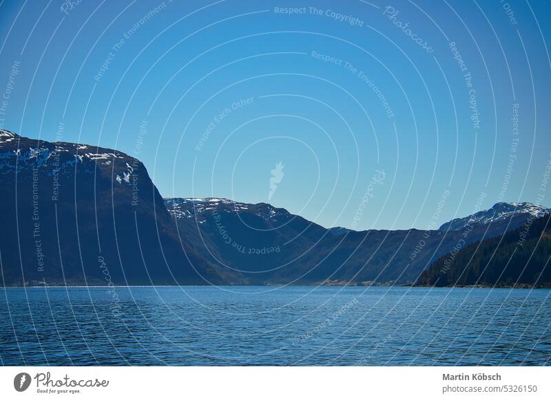 Fjord with view of mountains and fjord landscape in Norway. Landscape with blue sky sunset recreation nature wilderness panorama romantic nordic water fresh