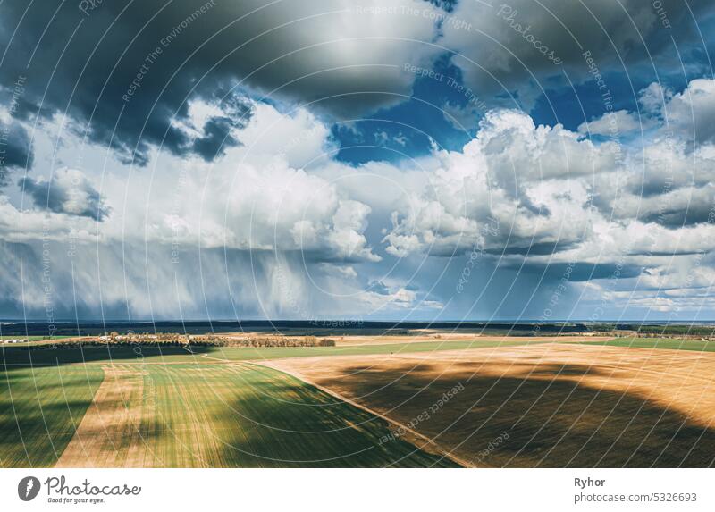 Scenic Sky With Fluffy Clouds On Horizon. Bird's-eye Aerial View. Amazing Natural Dramatic Sky With Rain Clouds Above Countryside Rural Field Landscape In Spring Summer Cloudy Day. Beauty In Nature