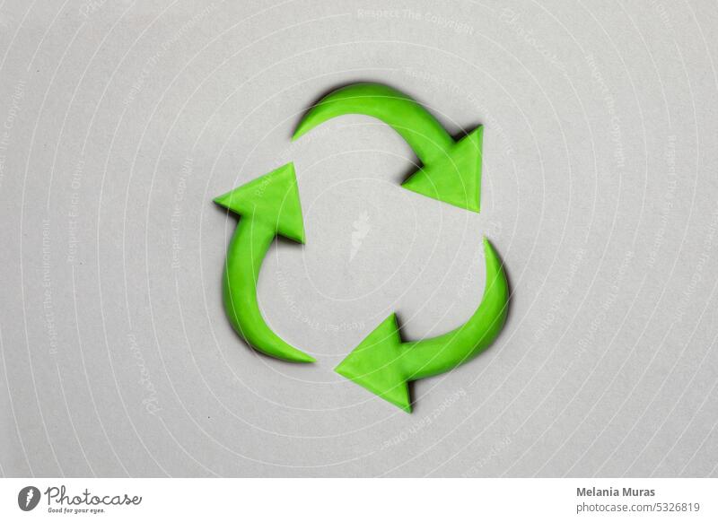3d recycling-Symbol made with plasticine. Sustainability concept on grey background. Green earth recycle concept. abstract arrow arrows bio care circle circular