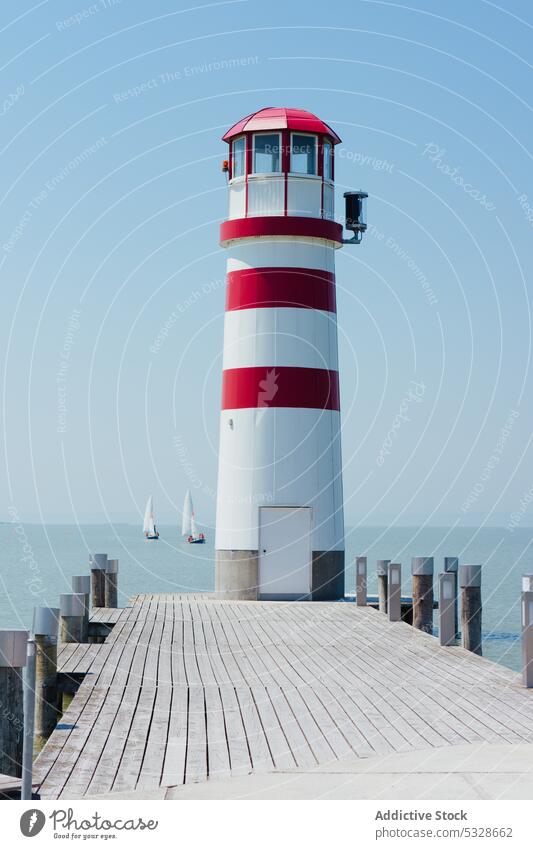 Picture of lighthouse in Austria architectural port maritime travel pier romantic sea nobody architecture shore water nature mole place see austria lake famous