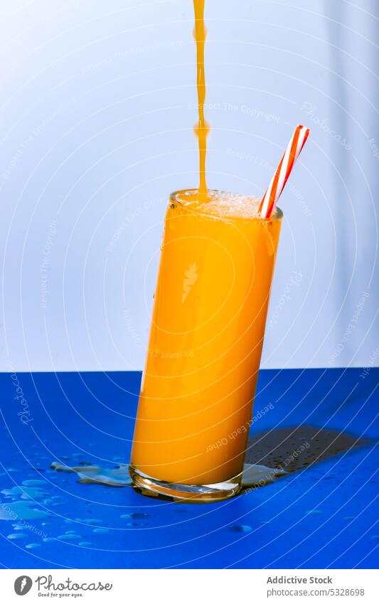 Glass of fresh orange juice cocktail glass drink refreshment fruit citrus beverage healthy serve tasty delicious organic cool bright colorful spill natural