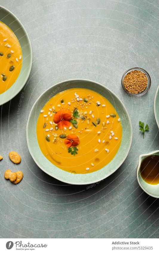 Tasty pumpkin cream soup with vegetables in bowls carrot vegetarian food lunch serve portion dish vegan meal delicious cuisine gourmet tasty herb healthy