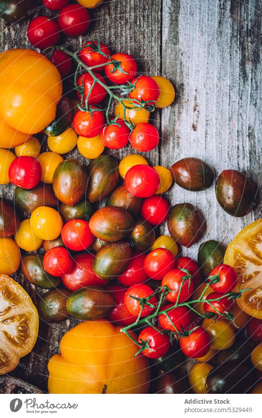 Assorted ripe tomatoes arranged on wooden table background vegetable fresh various harvest colorful food assorted vitamin organic healthy bright natural tasty