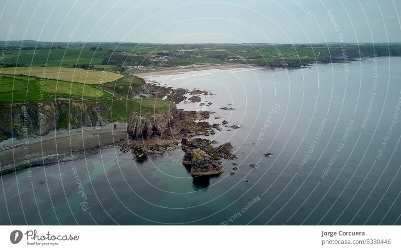 Drone view of Hills of Cooper Coast of Waterford Ireland. Tra na mB? beach. Irish coastline 4k above atlantic bay cliff aerial view cliffs cooper cooper coast