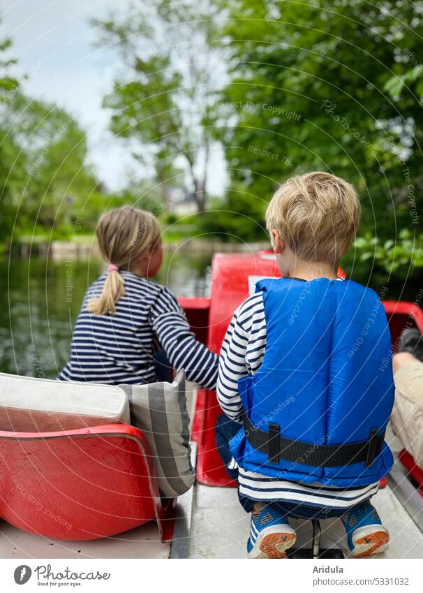 Back view of two children on a pedal boat on a lake Pedalo Lake Water Vacation & Travel Summer Tourism Trip Relaxation Leisure and hobbies Watercraft