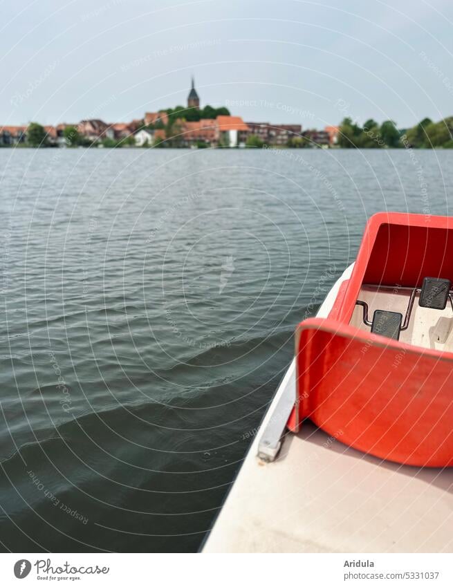 Pedal boat on a lake with small town in the background No. 2 Pedalo Lake Water Vacation & Travel Summer Trip Tourism Leisure and hobbies Exterior shot