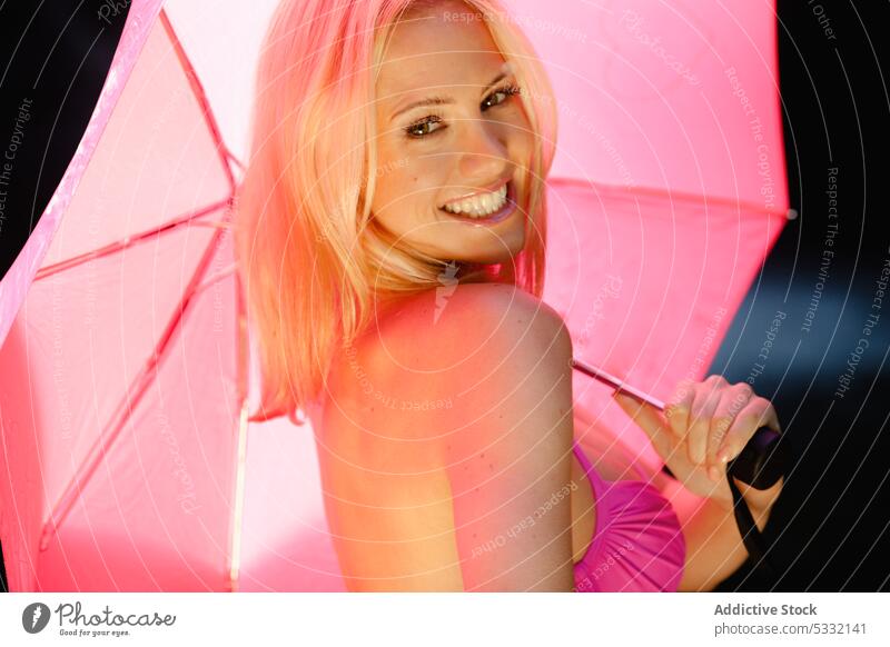 Cheerful female with pink umbrella woman smiling relax beautiful attractive cheerful excited nature model swimsuit swimwear sensual friendly bra rest leisure