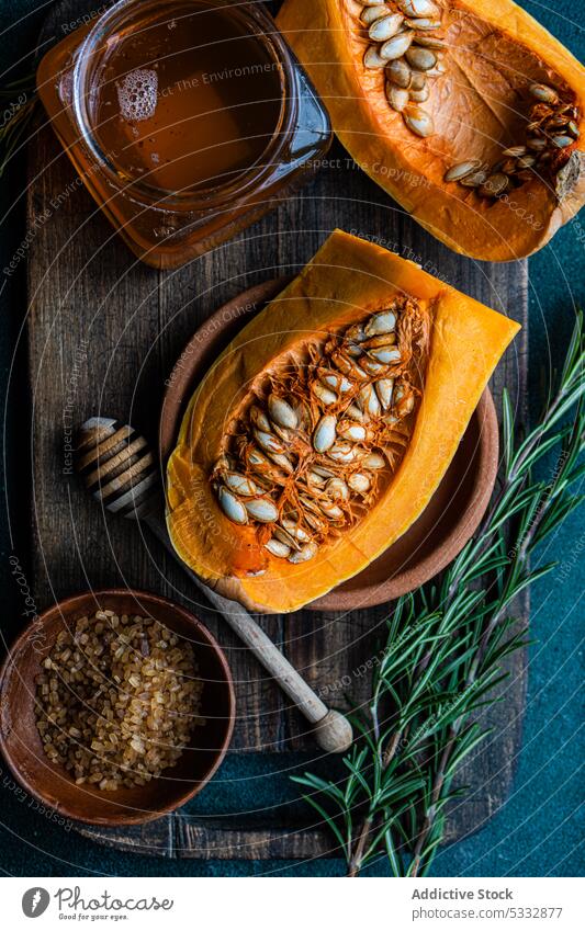 Raw pumpkin and ingredients bake baking board cook cooking coriander cube dish food fresh garlic healthy herbs lunch meal organic raw seed served set setting
