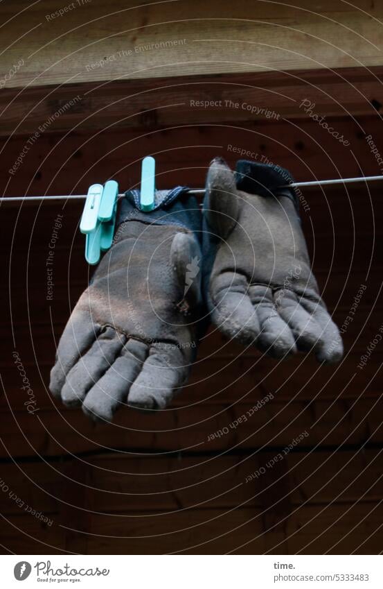 Closing time - work gloves on clothesline Work gloves Clothes peg Hang Dry Building Workplace Work utensils Protection Occupational health and safety Safety