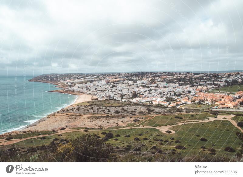 View of the city of Luz and the Atlantic Ocean beaches from the top of Atalaia hill in the Algarve region of southern Portugal. Following in the footsteps of the Fisherman Trail. Rota Vicentina
