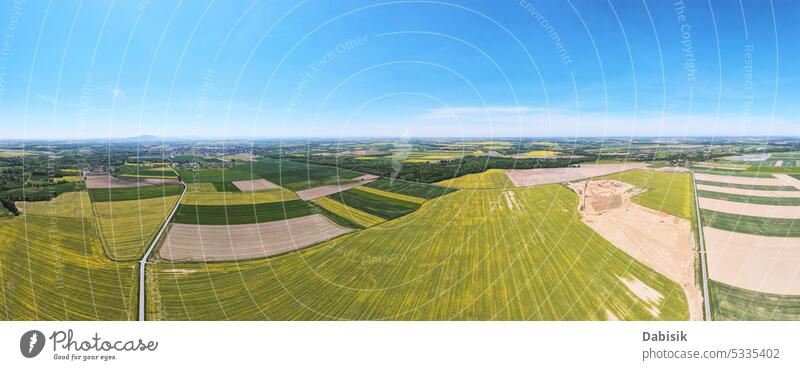 Aerial view of countryside with agricultural fields farmland aerial agriculture panorama landscape green daylight outdoor meadow barley summer europe beautiful