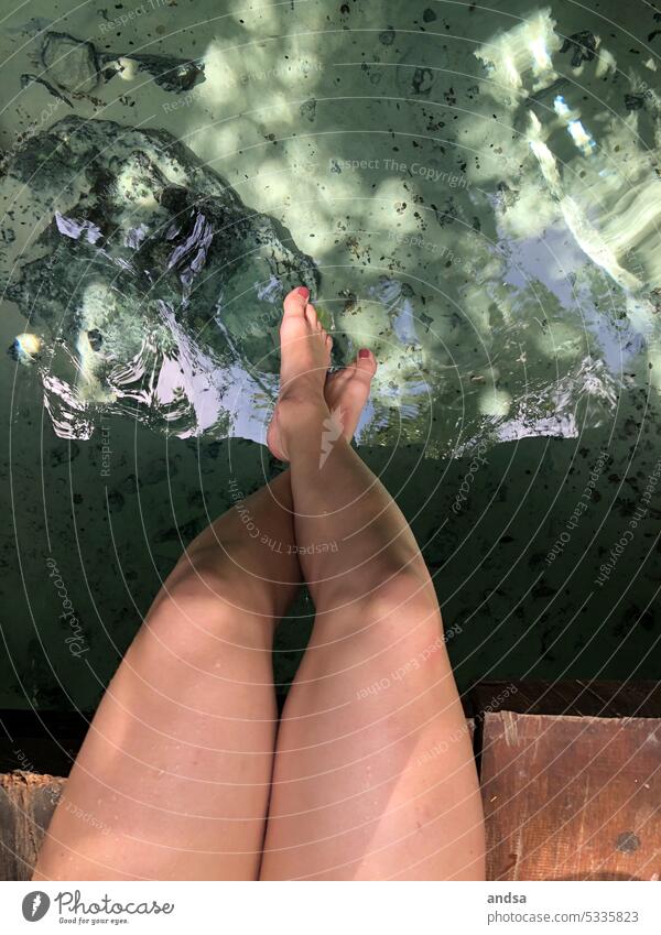 Bare legs photographed from above, above the water Legs Naked Nail polish feet from on high Dangle Water Summer Above water Legs crossed Footbridge