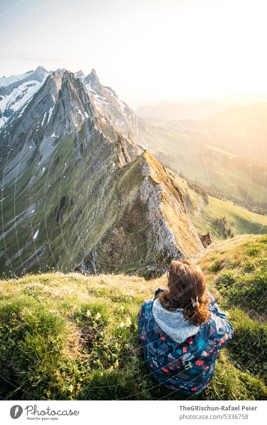 Woman in front of mountains with sunset Rock Switzerland appenzellerland Stone Hiking touristic Exterior shot Tourism Mountain Colour photo Alpstein Nature Sun