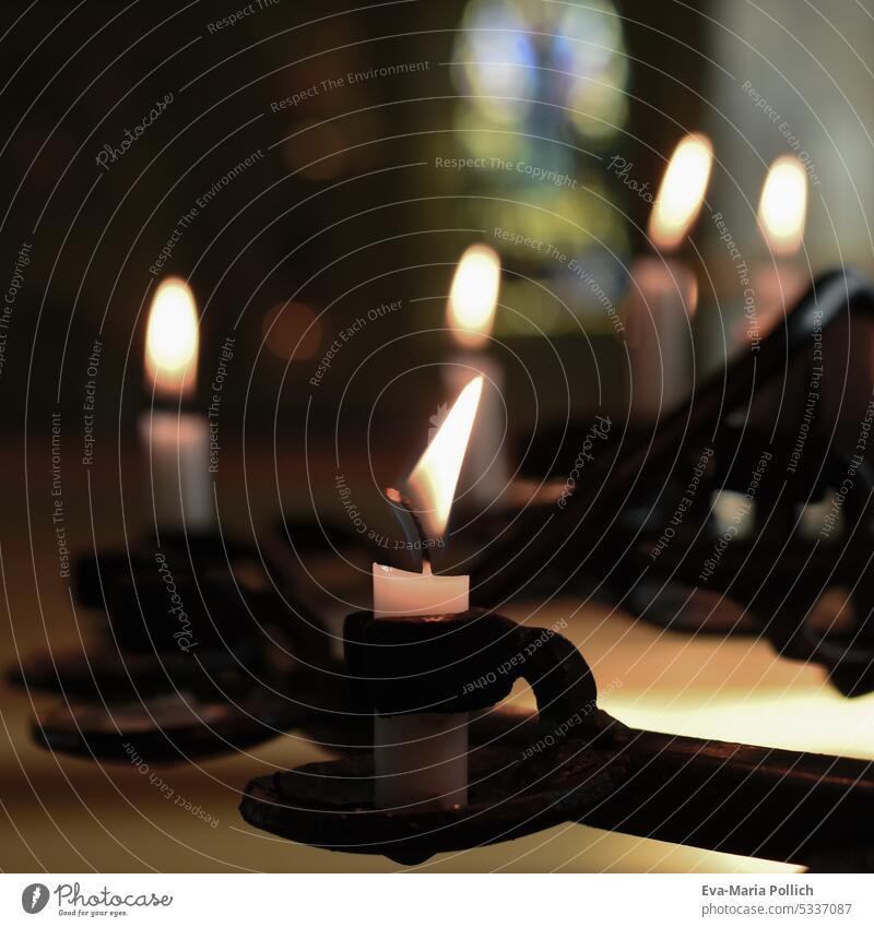 white burning candles in black holders in church Candlelight Religion and faith Prayer shoulder stand Grief pray God humility Life darkness symbol picture