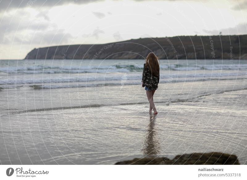 Young woman walking on beach Horizon Sea coast cloud landscape Expedition country Rising Erosion Landscape Freedom Wilderness Walking Bliss destinations explore