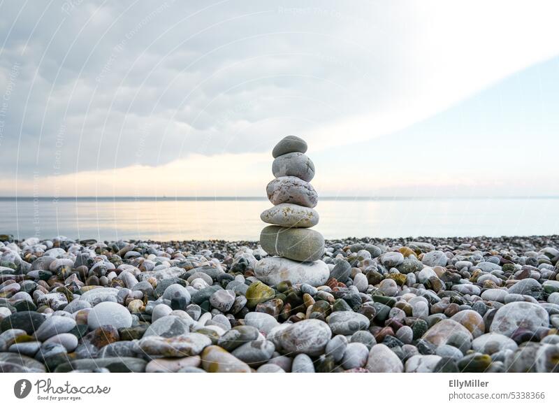Everything in balance tranquillity Meditation relaxation Relaxation Cairn Beach Balance stone tower stones pebble Tower Nature Stone Ocean Calm Water Harmonious