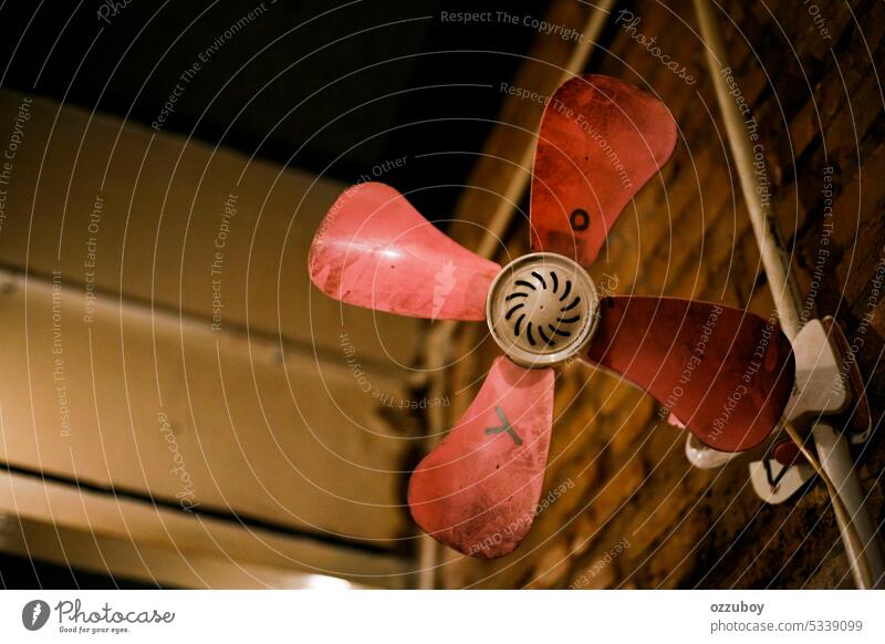 Close up dirty electric fan hanging on the wall yo ya Pink air appliance blow background cool home white blade equipment dust wind object old maintenance