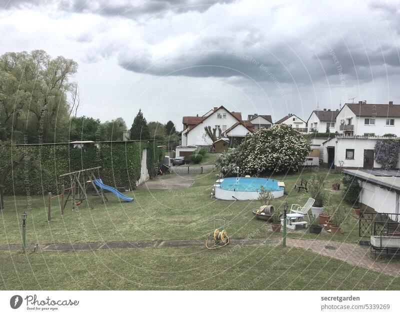 [MainFux 2023] Dramaqueen cloud Small Town pool Playground Lawn Garden Summer Weather Dark Blue Green Gray Exterior shot Nature Grass Day Deserted Colour photo