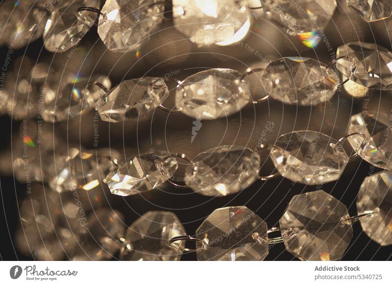 Close-up of shining crystals in chain diamond chair abstract background glow luxury jewelry shimmer sparkles light wealth many ornamental rich design glimmer