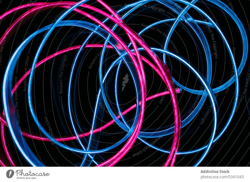 Stack of neon light tubes abstract art creative bright colorful beautiful connection curve line shape texture illustration image graphic concept blue pink