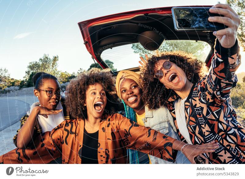 Happy black women taking selfie near car group using smartphone friend cheerful roadside summer african american ethnic female friendship together mobile street